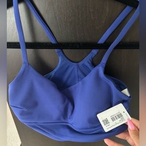 Lululemon Athletica WunderTrain Strappy Wrapped Bra
Size 8 C/D cup;Deep Sea Blue
